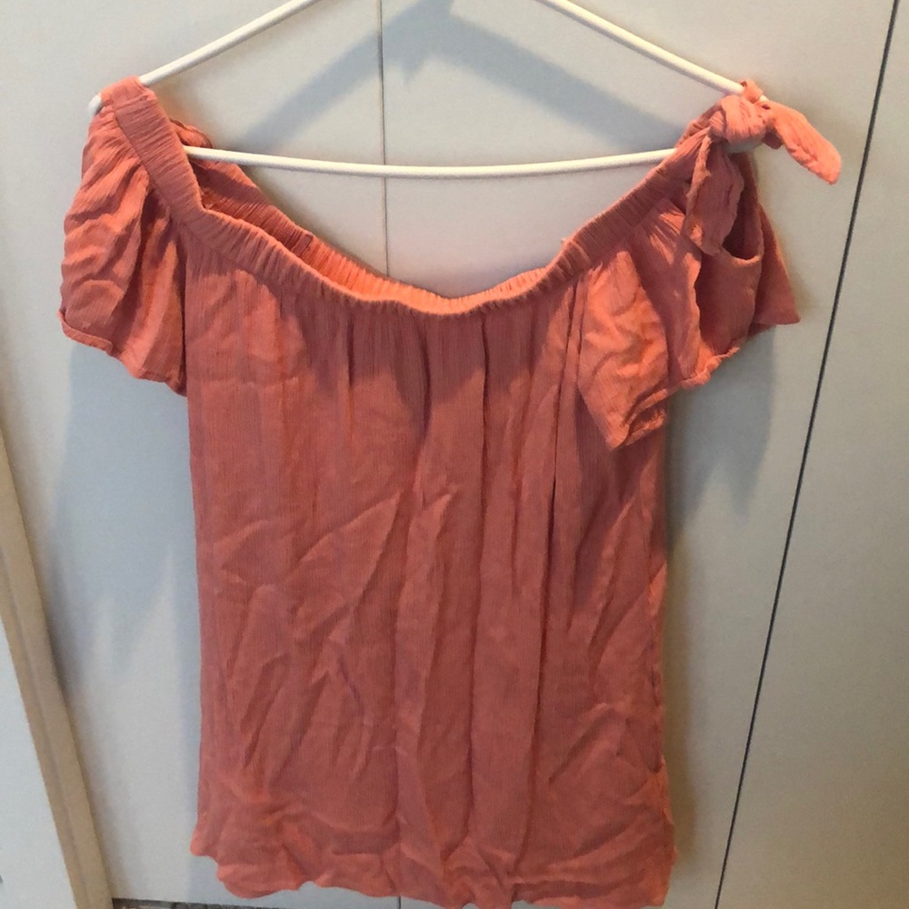Pretty pink off the shoulder dress.